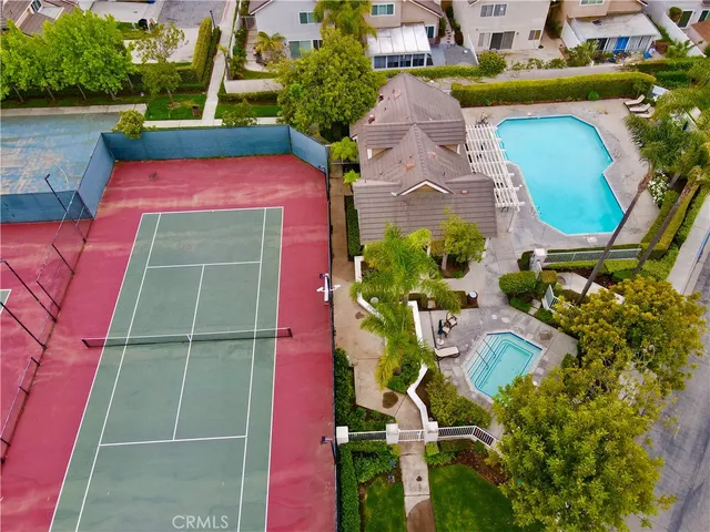 an aerial view of a house with a swimming pool