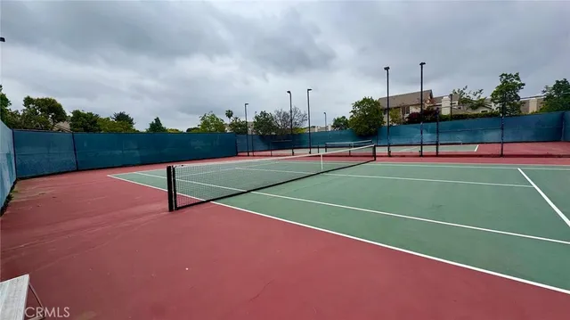a view of an outdoor space and tennis court