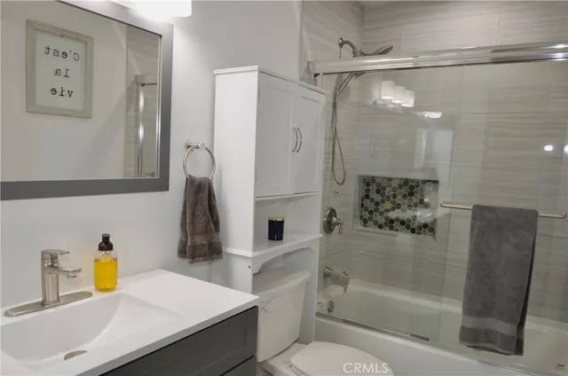 a bathroom with a sink and a shower