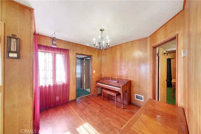 a bedroom with two beds and a table