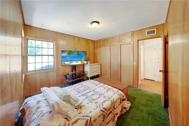 a bathroom with a sink vanity mirror and toilet