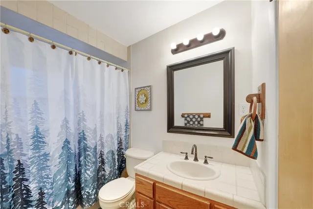 a spacious bedroom with a bed and a window