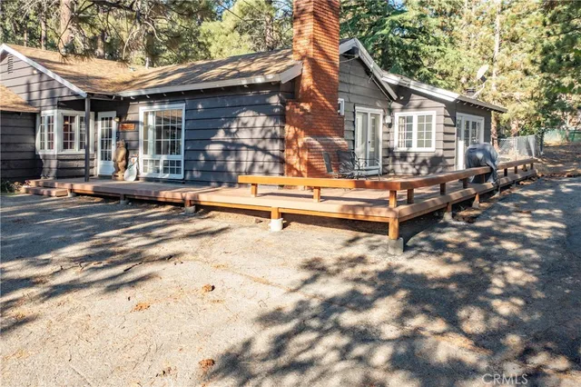 a view of a barn in the middle of a yard