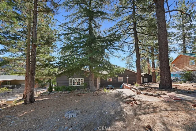a tall building with trees in the background