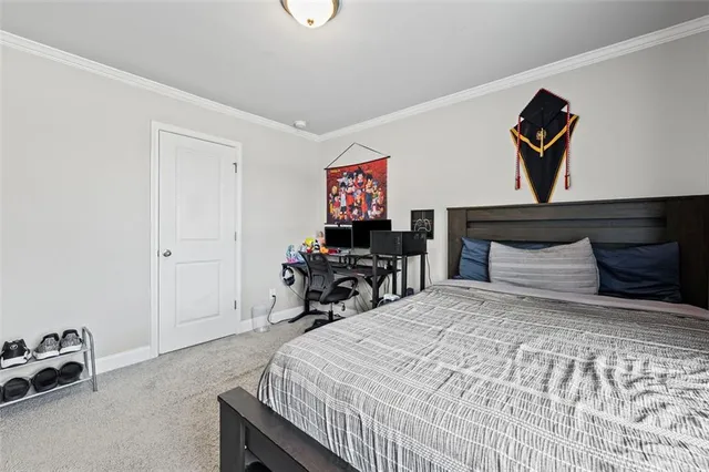 a bedroom with a bed and cabinets