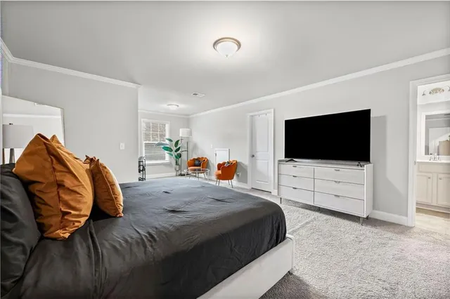 a spacious bedroom with a bed and dresser