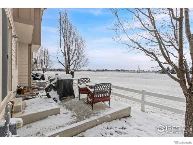 a view of a terrace with chairs and a table