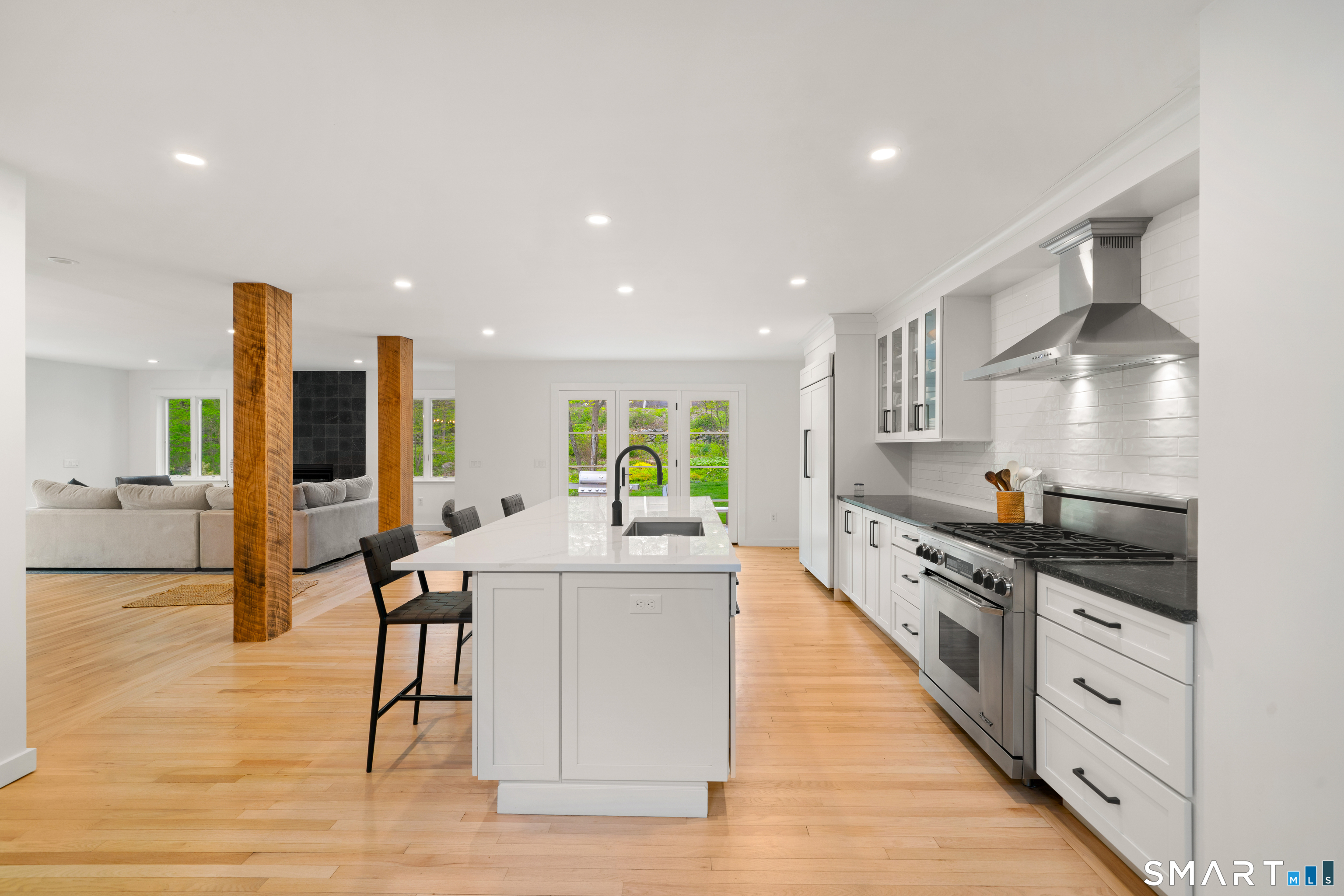 23 Norton Road Easton, CT 06612 - Photo 5 of 40 An oversized quartz outlined is the center point of the kitchen.
