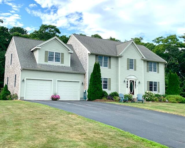 16 Tiffany Road Monument Beach, MA 02532 - Photo 1 of 42 a front view of a house with a yard