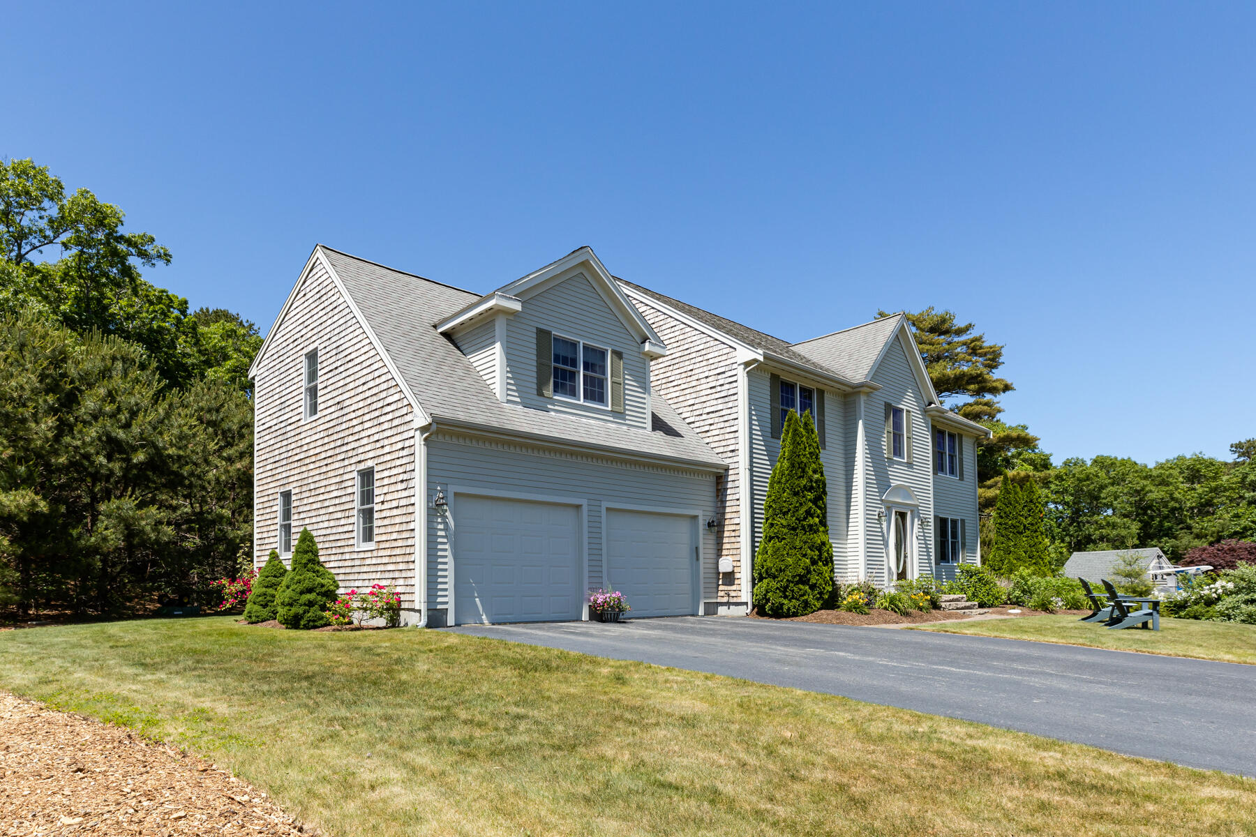 16 Tiffany Road Monument Beach, MA 02532 - Photo 34 of 42 a front view of a house with a garden