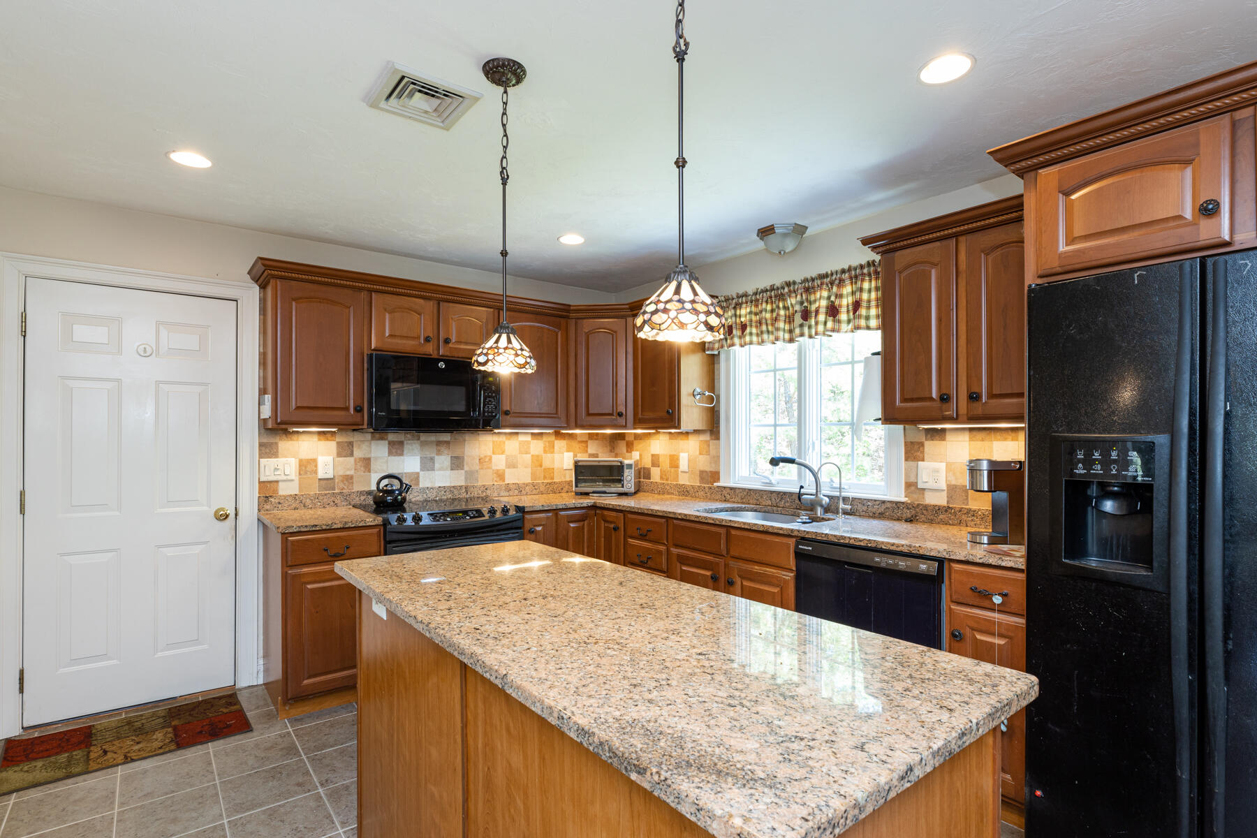 16 Tiffany Road Monument Beach, MA 02532 - Photo 4 of 42 a kitchen with stainless steel appliances granite countertop a sink stove and refrigerator