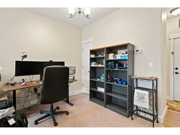 a kitchen with stainless steel appliances kitchen island granite countertop a refrigerator a stove a sink dishwasher and a microwave with wooden floor
