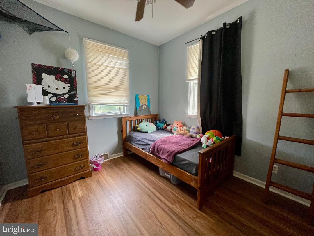 904-906 Main Avenue Croydon, PA 19021 - Photo 20 of 51 a bedroom with a bed and wooden floor