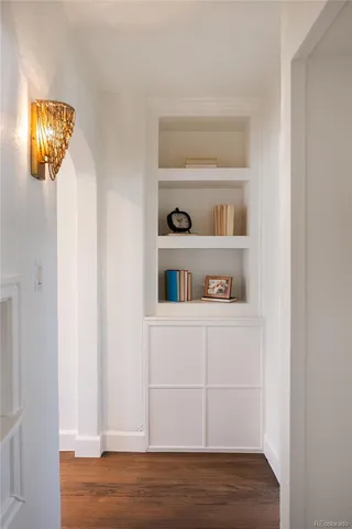 a view of dresser and wooden floor