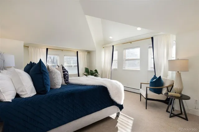 a bedroom with a bed and a couch