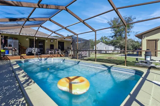 a view of a swimming pool with a patio