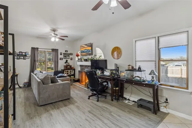 a living room with furniture and a large window