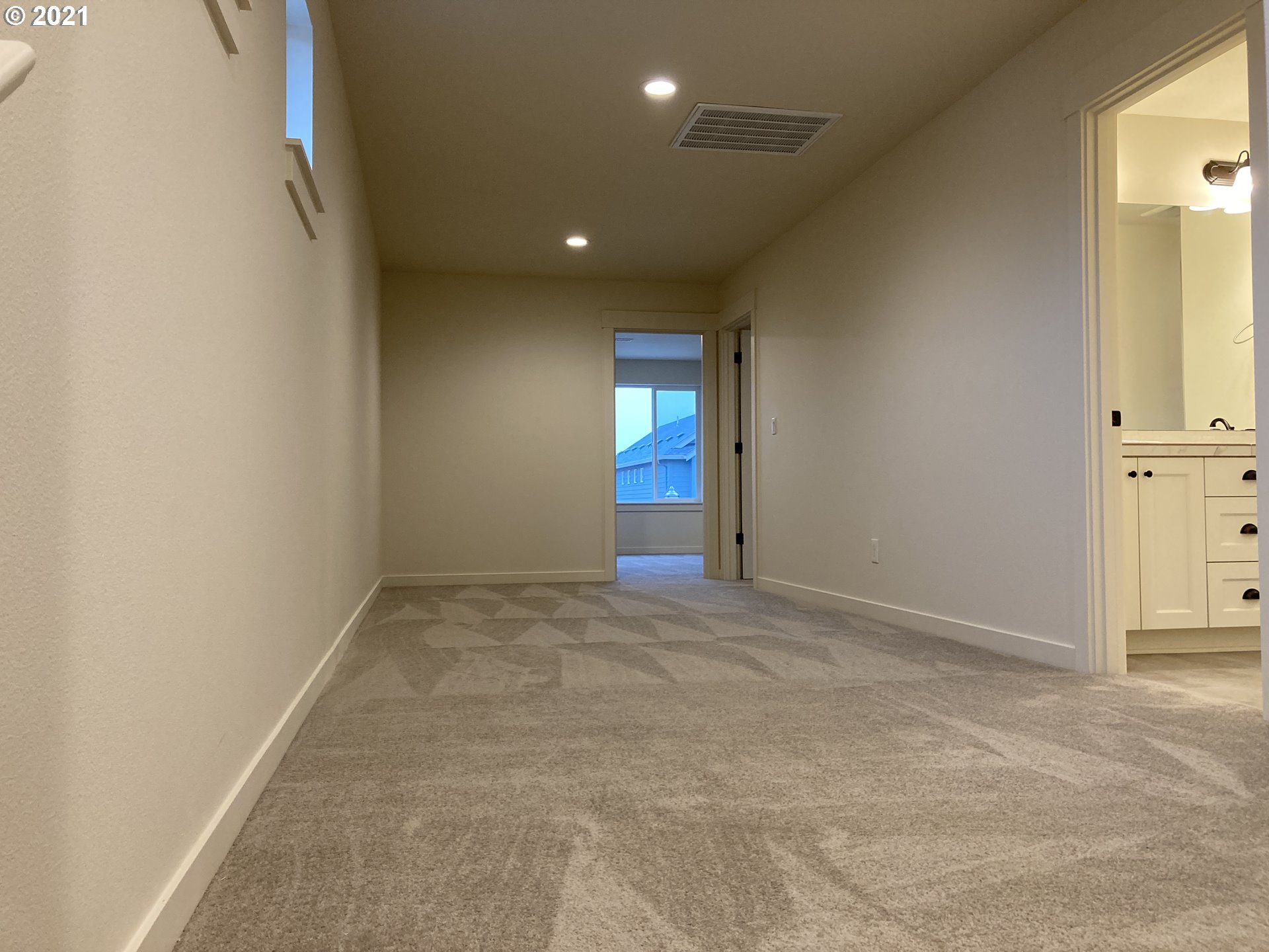 7023 South Ridge Way Ridgefield, WA 98642 - Photo 5 of 13 an empty room with windows and entrance