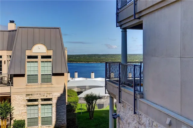 a view of a patio with table and chairs and potted plants