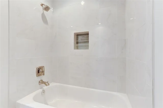 a bathroom with a white bath tub