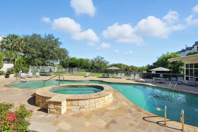 a view of a swimming pool with a patio