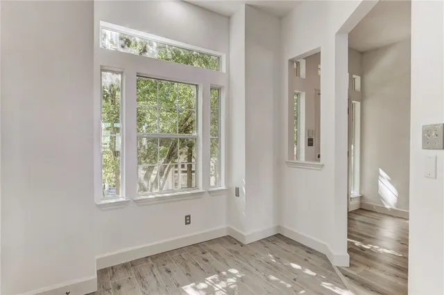 a view of an empty room with a window