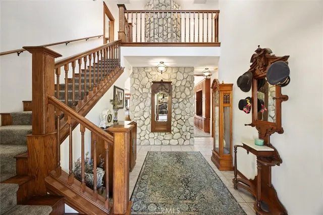 a bedroom with a bed and a lamp on dresser
