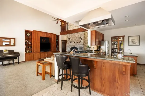 a view of a patio with a dining table and chairs