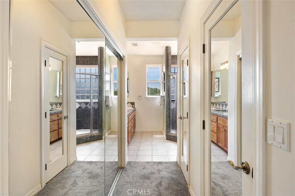 5625 Linne Road Paso Robles, CA 93446 - Photo 39 of 75 a bathroom with a glass shower door and a glass door
