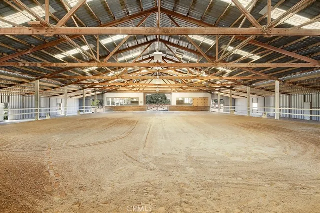 a view of a building with snow on the road