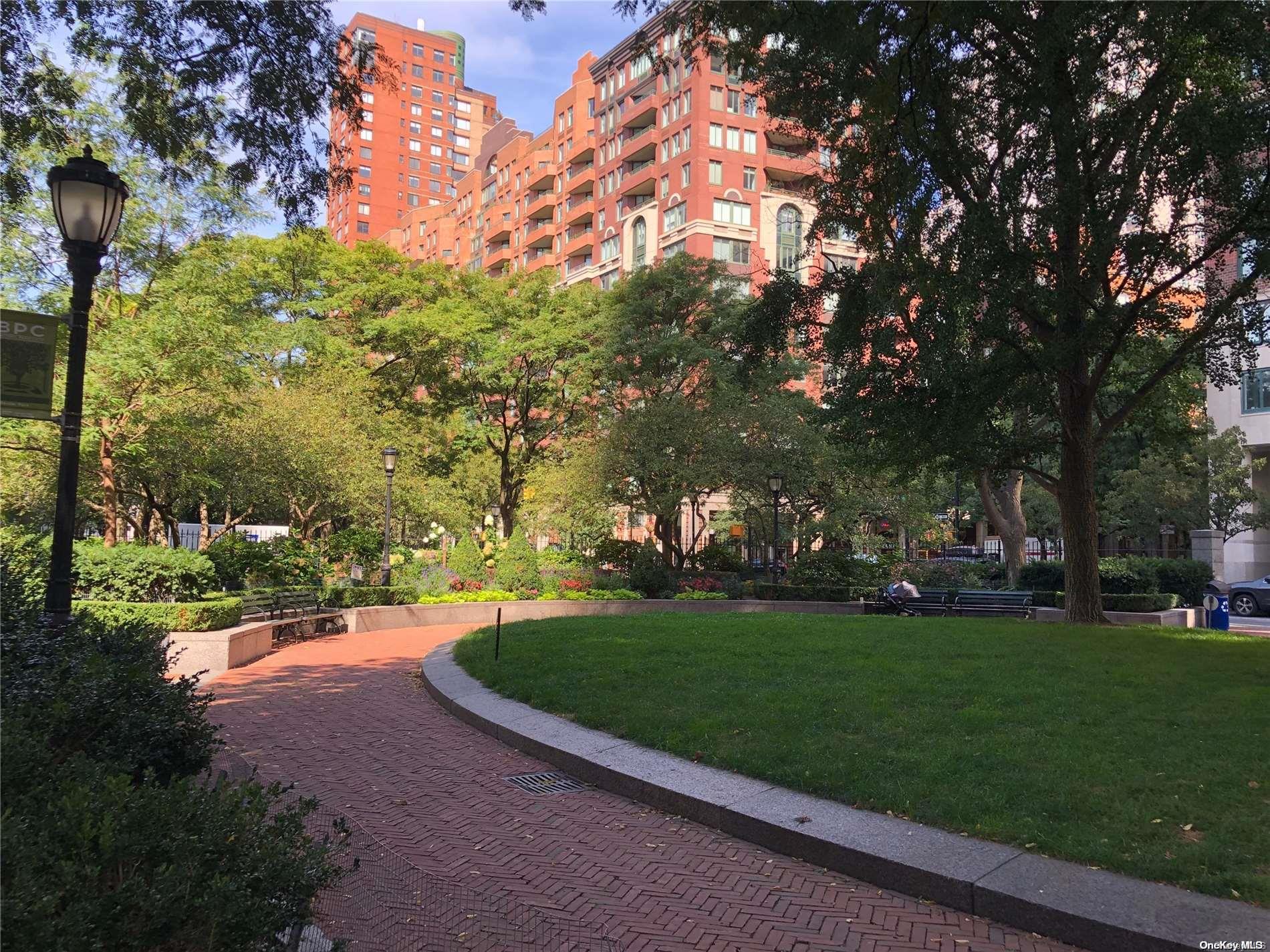 200 Rector Place, Unit 35E Manhattan, NY 10280 - Photo 16 of 33 a view of a park with large trees