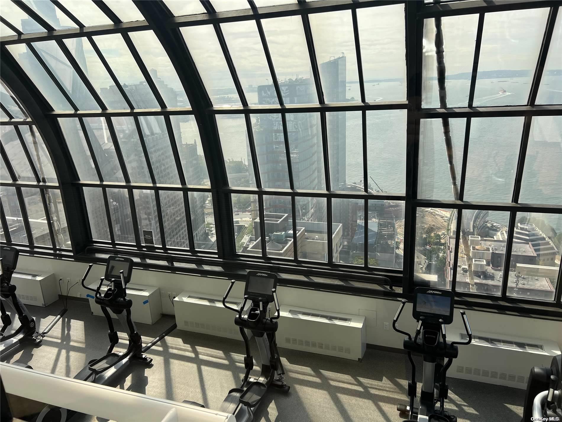 200 Rector Place, Unit 35E Manhattan, NY 10280 - Photo 18 of 33 a view of a room with gym equipment