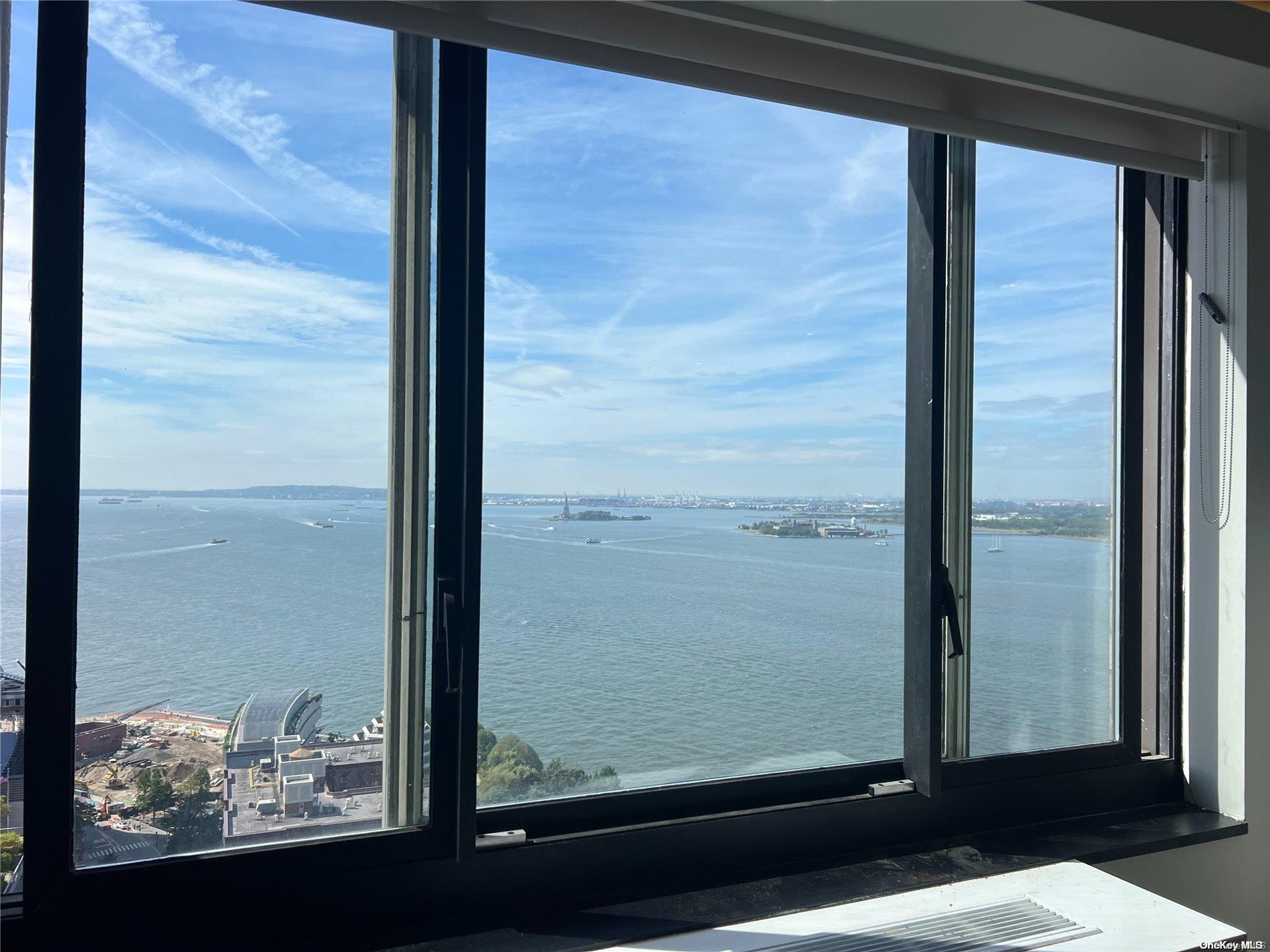 200 Rector Place, Unit 35E Manhattan, NY 10280 - Photo 27 of 33 a view of a glass door