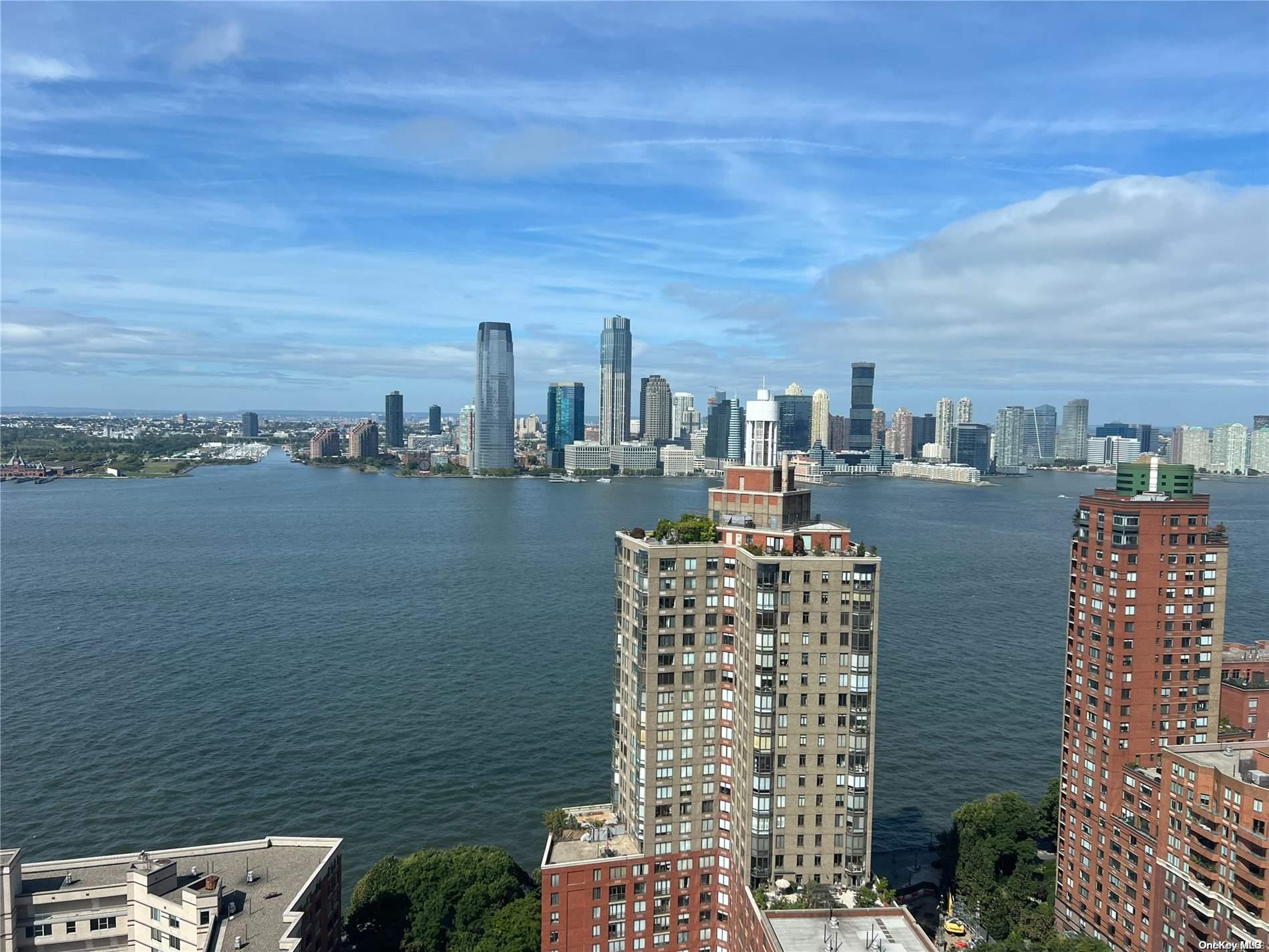 200 Rector Place, Unit 35E Manhattan, NY 10280 - Photo 28 of 33 a view of ocean with a multi story building