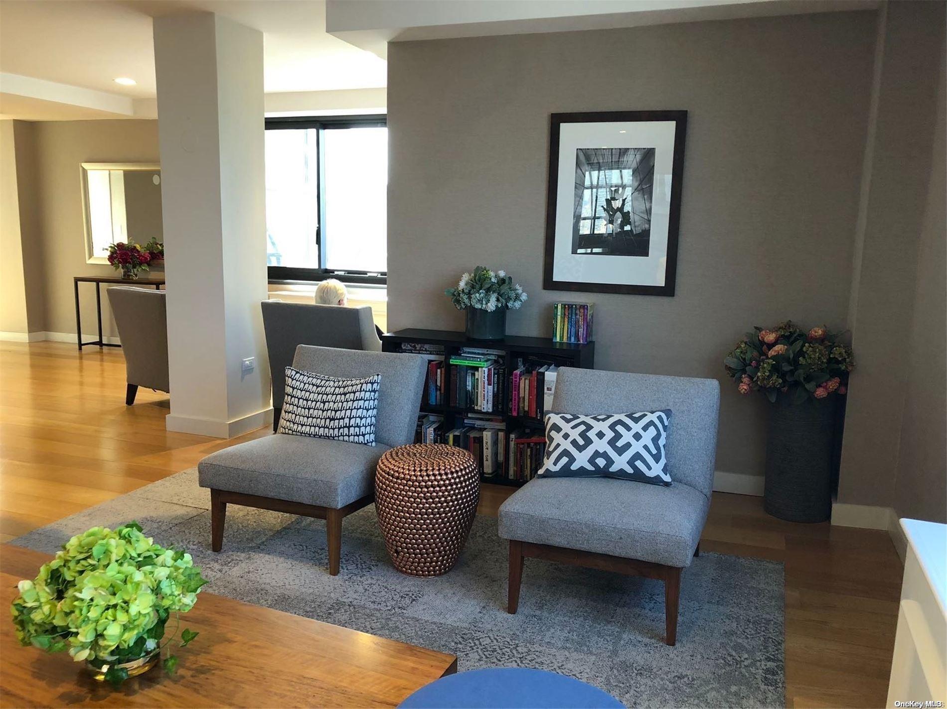 200 Rector Place, Unit 35E Manhattan, NY 10280 - Photo 8 of 33 a living room with furniture and a couch