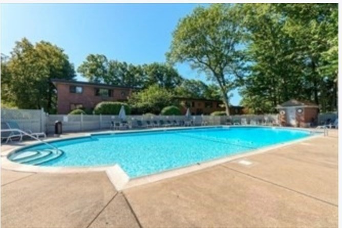 1325 Worcester Road, Unit A11 Framingham, MA 01701 - Photo 16 of 18 a backyard of a house with lots of green space