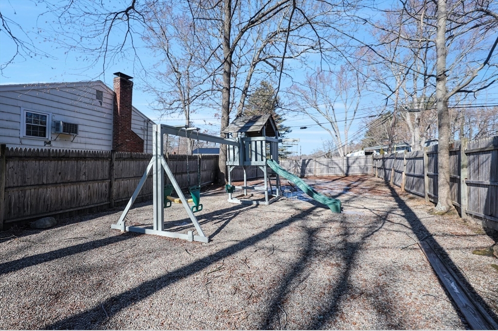 1325 Worcester Road, Unit A11 Framingham, MA 01701 - Photo 17 of 18 a view of a backyard with a table and wooden