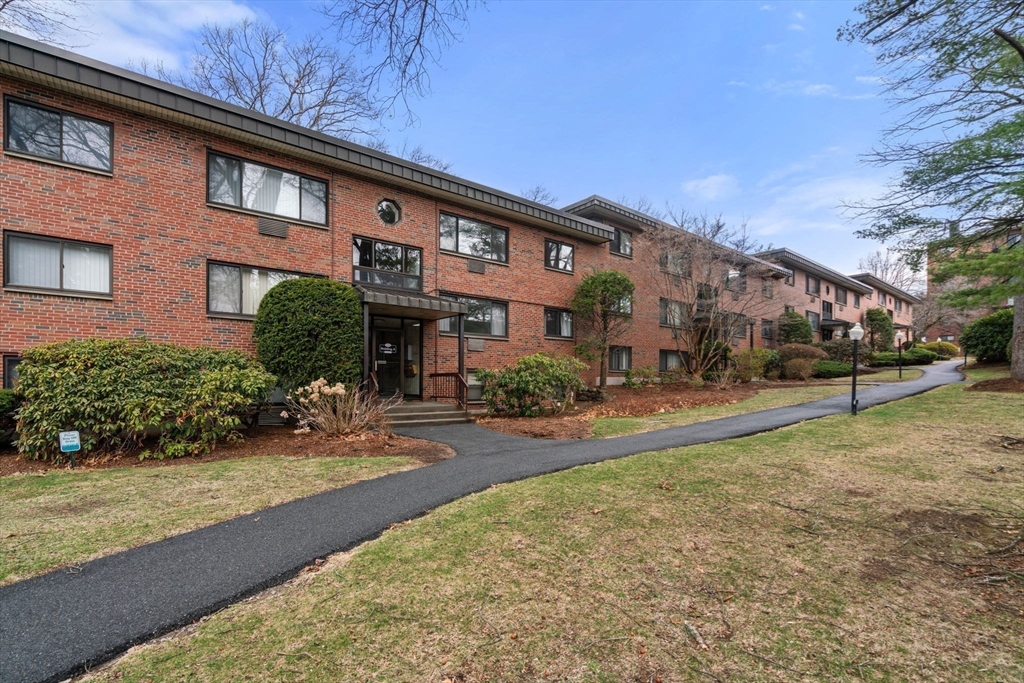 1325 Worcester Road, Unit A11 Framingham, MA 01701 - Photo 18 of 18 a front view of a building with garden