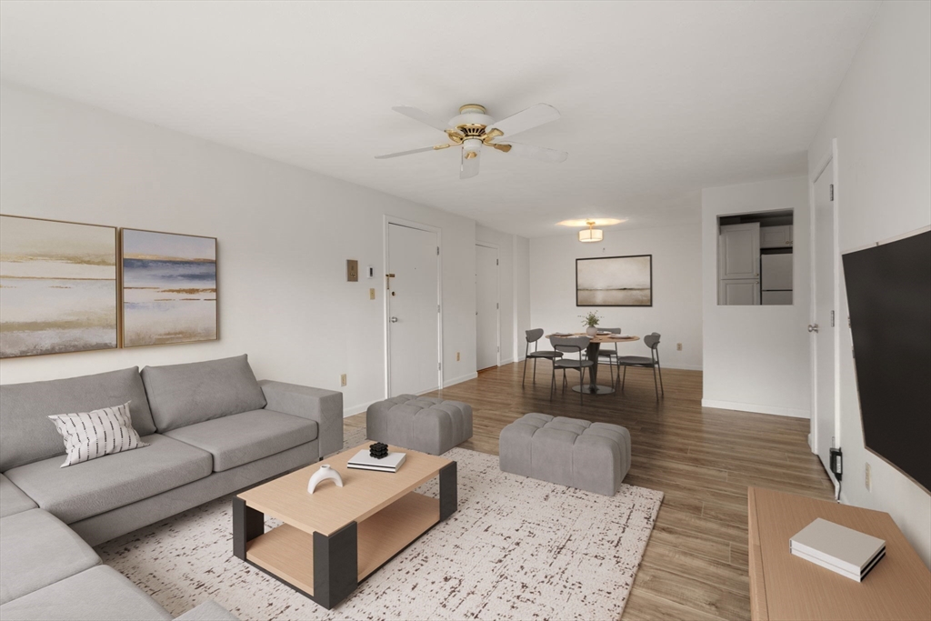 1325 Worcester Road, Unit A11 Framingham, MA 01701 - Photo 4 of 18 a living room with furniture and a flat screen tv