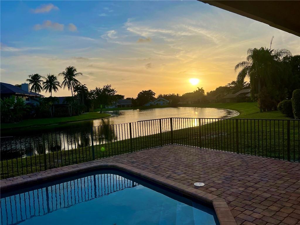 3110 Equestrian Drive Boca Raton, FL 33434 - Photo 2 of 48 Sunset from the Pool