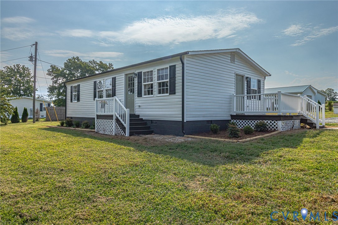36 Bundick Road Lottsburg, VA 22511 - Photo 34 of 50 White siding exterior with dark shutters, front en