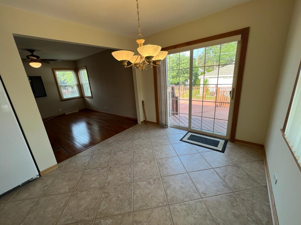 4031 Custer Avenue Lyons, IL 60534 - Photo 12 of 38 a view of an empty room with window and chandelier