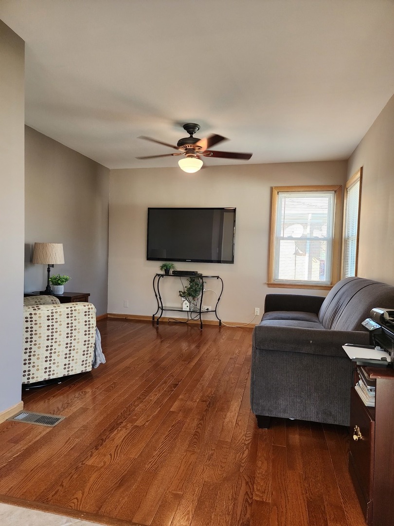 4031 Custer Avenue Lyons, IL 60534 - Photo 15 of 38 a living room with furniture and a flat screen tv