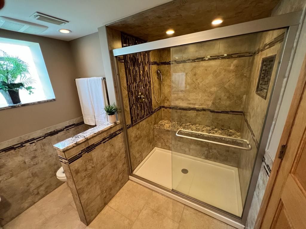 4031 Custer Avenue Lyons, IL 60534 - Photo 20 of 38 a bathroom with a granite countertop sink mirror and shower