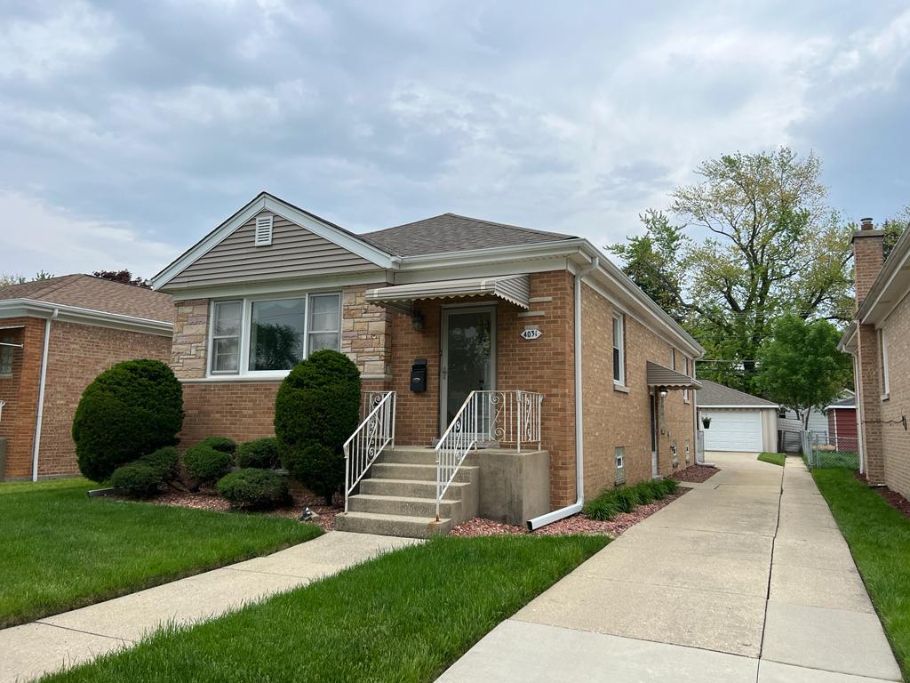 4031 Custer Avenue Lyons, IL 60534 - Photo 3 of 38 a front view of a house with a yard
