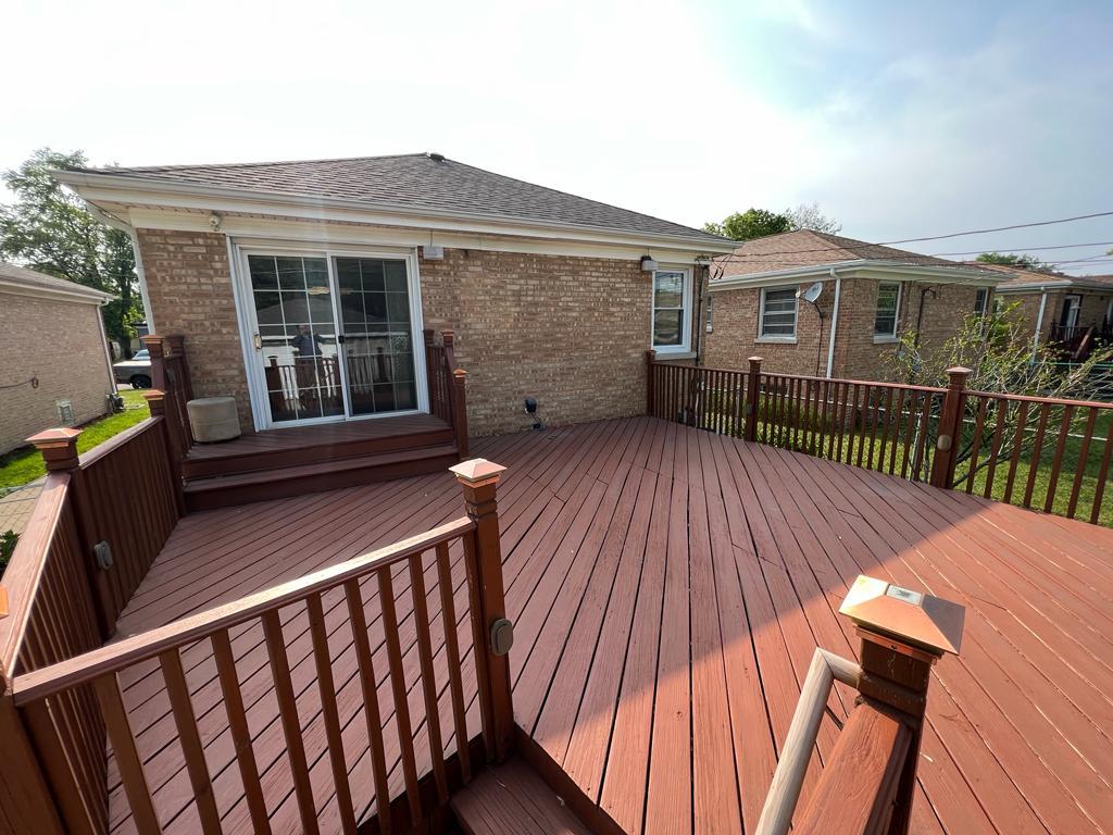 4031 Custer Avenue Lyons, IL 60534 - Photo 34 of 38 a view of a house with wooden deck