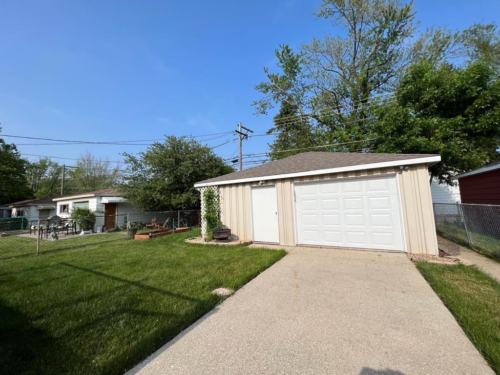 4031 Custer Avenue Lyons, IL 60534 - Photo 38 of 38 a view of a house with a yard and garage