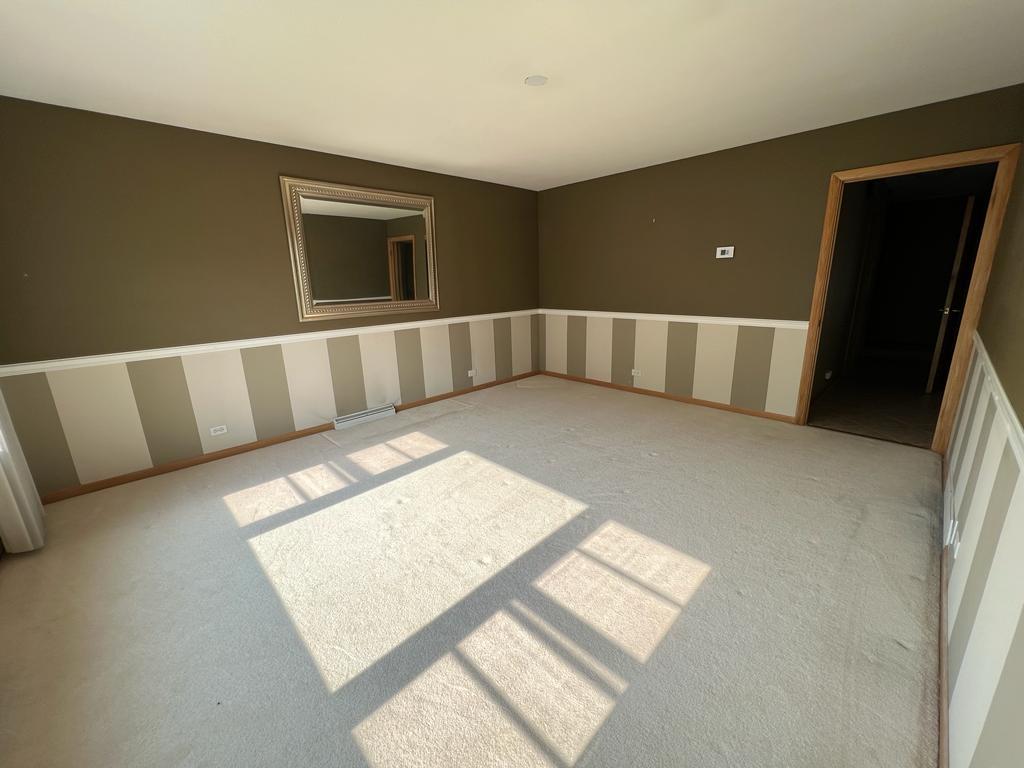 4031 Custer Avenue Lyons, IL 60534 - Photo 5 of 38 a view of an empty room with windows