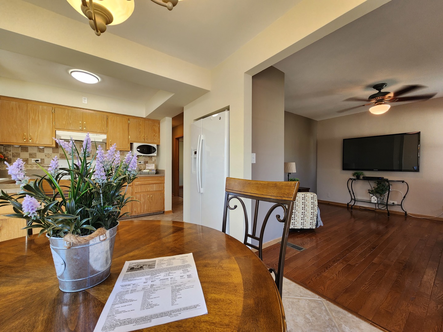 4031 Custer Avenue Lyons, IL 60534 - Photo 10 of 38 a living room with furniture potted plant and a flat screen tv