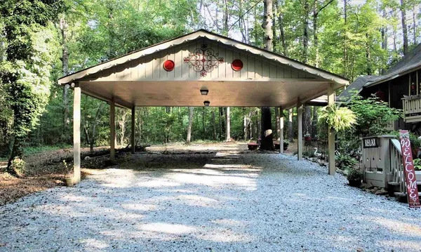 a front view of house with yard and outdoor seating